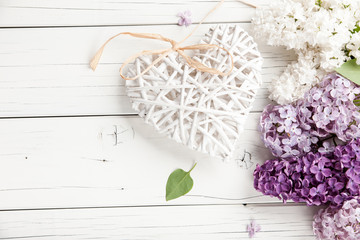 Lilac flowers background with heart