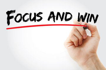 Hand writing Focus and win with marker, business concept