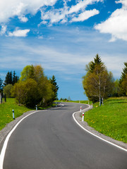 Fototapeta premium Narrow rural asphalt road in the mountains
