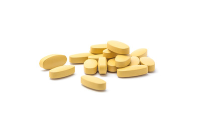 brown pills on white background