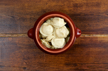 Russian dumplings in clay pot