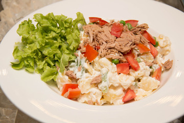 salad with tuna on white plate