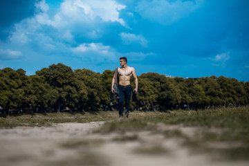 Fototapeta premium Sexy muscular man with bag