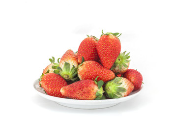 Red Strawberries on white plate isolated on white background.
