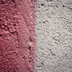 Pink paint on concrete surface. Frame for text. Aged photo. Color wall macro background. City building texture. Toned effect. painted wall close up. Retro filter.