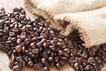 Coffee beans on wooden backround