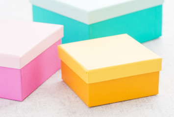 Cardboard package container for a present, colorful gift boxes, Concept of celebration, birthday or event. Simple and clean packaging picture to be used as blank dummy or background.