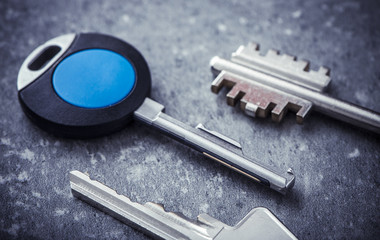 New modern keys in close-up. Concept image of new property, buying an estate or home security.