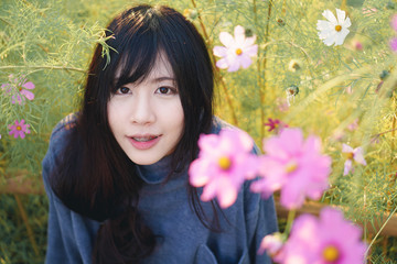 Asian girl with Cosmos Flower