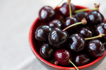 Cherries in a red bowl