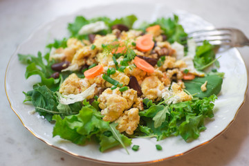 Vegetable omelet with mixed salad leafs