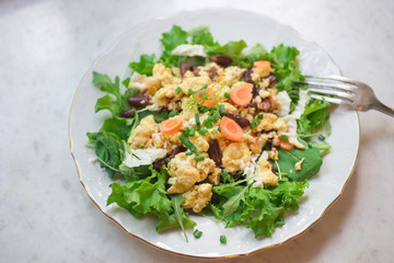 Vegetable omelet with mixed salad leafs