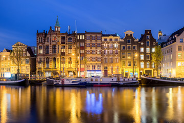 Naklejka na ściany i meble Traditional Dutch houses at night in Amsterdam, Netherlands.