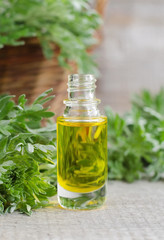 Small bottle of cosmetic oil with natural (herbal) extracts 