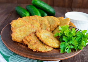 Village vegetarian pancakes made from potatoes in a clay bowl. 