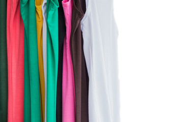 set of colorful t shirt hanging on rack