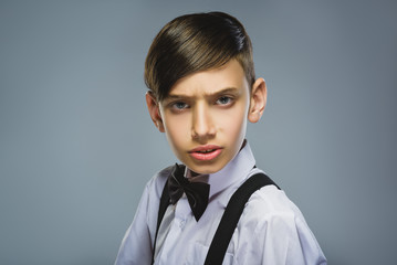 Closeup defiant boy with worried stressed face expression