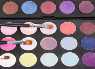 Eyeshadow palette cosmetic brushes and makeup. Background. 