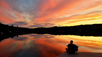 Naklejka na ściany i meble Beautiful cottage sunset on the dock