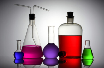 Laboratory glassware with liquids of different colors