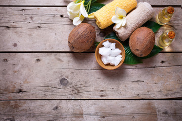Fototapeta na wymiar Coconuts, coconut oil and towels