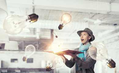 Fototapeta premium Student girl with book in hands