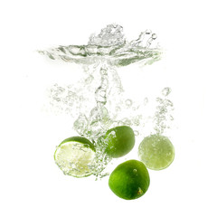 Limes splash on water, isolated on white background. Fresh drinks advertisment