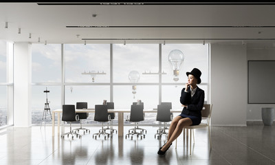 Businesswoman on chair in office