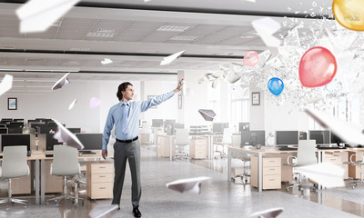 Businessman with aerosol can