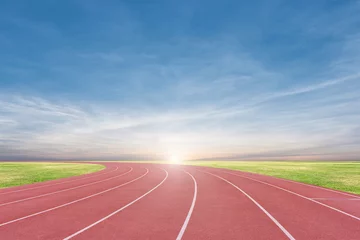 Fotobehang Athlete track or running track with sky sunset background © yotrakbutda