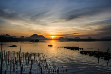 Naklejka na ściany i meble Landscape of beautiful sunrise at fisherman village in Thailand