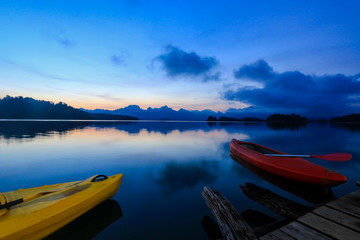 Kayak boats on the lake with beautiful twilight sky