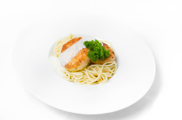Spaghetti with chicken meatballs on a white background