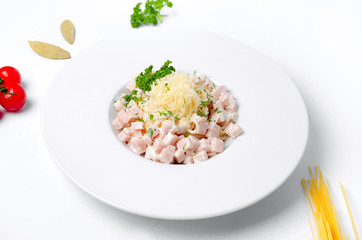 Spaghetti carbonara on a white background