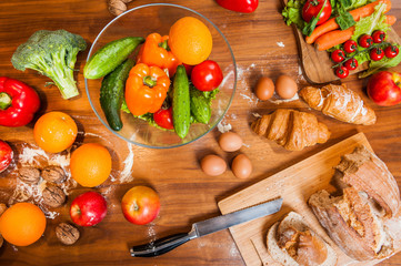 topview of Fruits and vegetables on wooden kitchen table 