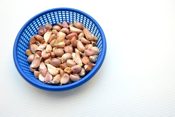 Garlic in blue plastic backet