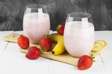 Milkshake with strawberry and banana in glasses