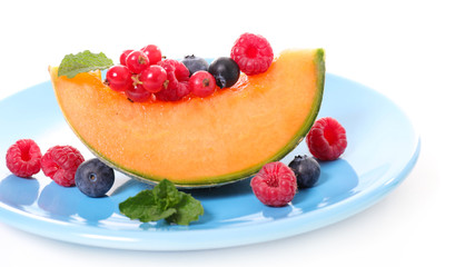 slices melon with berries fruits