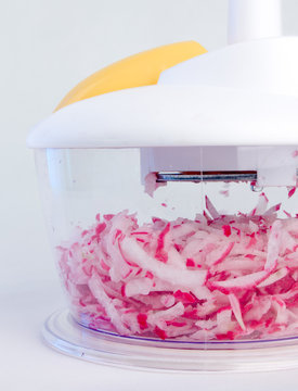 Mechanical Kitchen Grater Is Filled With Shredded Red Radish