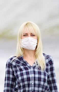 The woman in respirator. Protection against viruses.