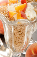 chestnut puree with whipped cream and peach in a dessert glass