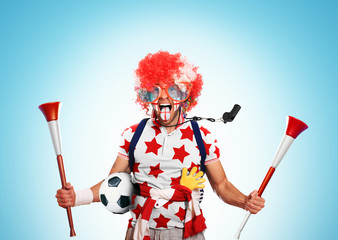 English football fan in a red wig and horns