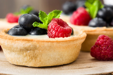 Delicious tartlets with raspberries and blueberries
