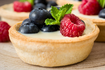 Delicious tartlets with raspberries and blueberries
