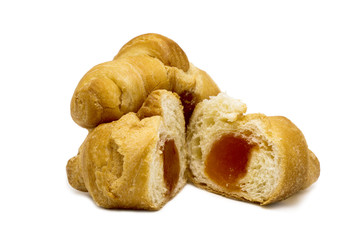 Delicious sliced croissant with filling on white background