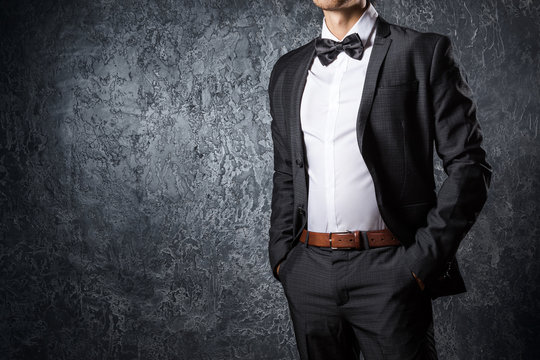 Stylish man in suit with bow tie