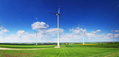 Fototapeta na wymiar Wind turbines in front of blue sky
