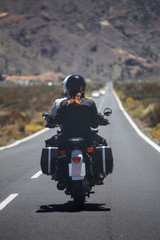 couple on a motorcycle traveling