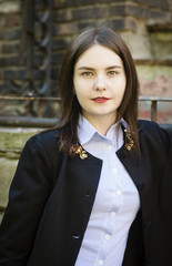 Portrait of a beautiful young girl in a black jacket