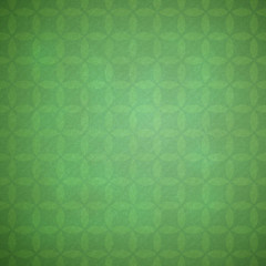 Green grunge background with pale geometric pattern.